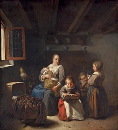 Nursing mother with three girls by Caspar Netscher