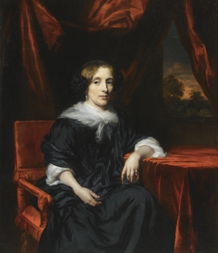 Portrait of a Woman in a Black Dress seated in a Red Velvet chair