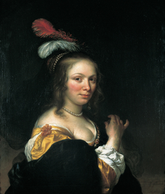 Portrait of a woman wearing a hat with feathers