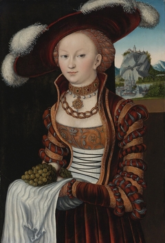 Portrait of a young lady holding a bunch of grapes by Lucas Cranach the Elder