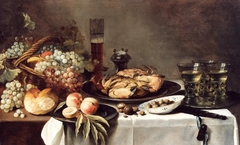Still life with crab, fruit, salt cellar, berkemeyers, and a china bowl of olives by Pieter Claesz