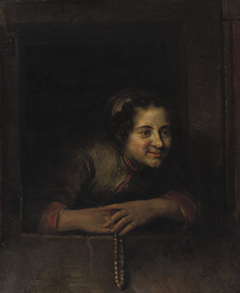 Young woman leaning out of a window; holding a necklace