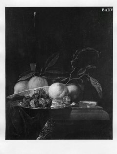 A lemon and orange in a porcelain bowl, a glass of wine, dates on a silver plate, an apple, a peach and a knife, all on a partially draped table by Juriaen van Streeck