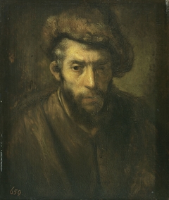 Bust of a man with a fur hat by Rembrandt