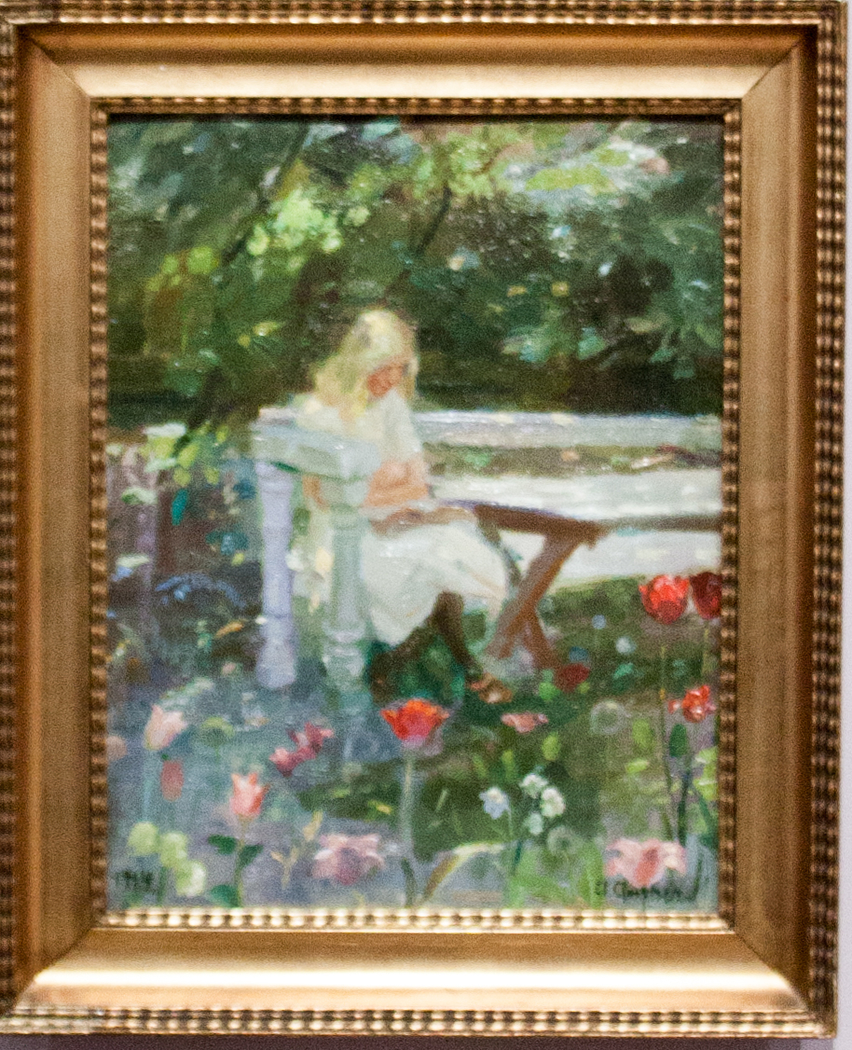 A girl in the garden in summertime