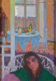Interior with a Woman in a Wicker Chair