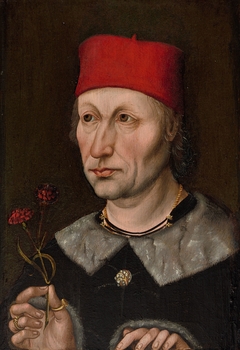 Man in a Red Cap Holding a Carnation