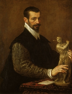 Portrait of Tiziano Aspetti holding a statuette