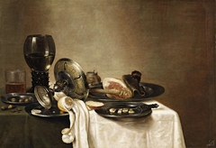 Still life with roemer, tazza, ham and lemon by Gerret Willemsz Heda