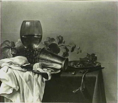 Still life with roemer, silver cup, lemon, and knife