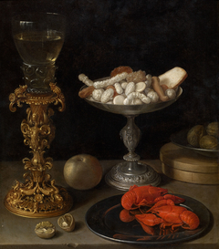 A roemer on a silver-gilt bekerschroef, sweetmeats in a silver tazza, langoustines on a plate, walnuts and an apple on a table top
