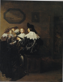 Company with a man playing the lute, seated at a table