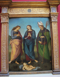 Maria, Johannes Ev. und der hl. Nikolaus (Augustinus?) beten das Christkind an