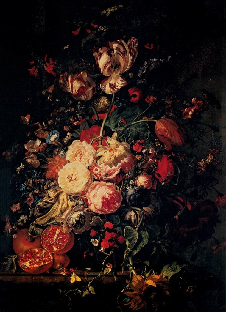 Flowers in a glass vase, with pomegranites, on a marble balustrade