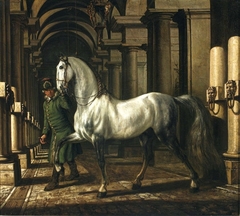 Groom leading a horse