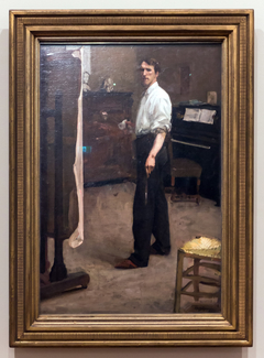 Portrait of the artist standing before easel by Hugh Ramsay
