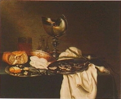Still life with nautilus cup, herring, onion, and bread