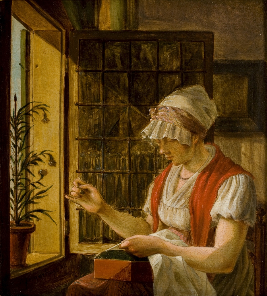 Vrouw met naaiwerk