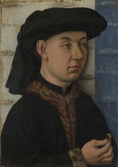 A Young Man holding a Ring by a follower of Jan van Eyck