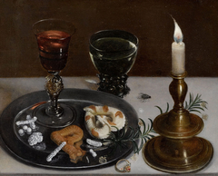 Still life with dainties, rosemary, wine, jewels and a burning candle
