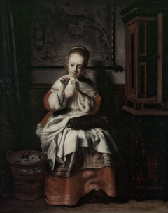 A Girl Sewing by Nicolaes Maes