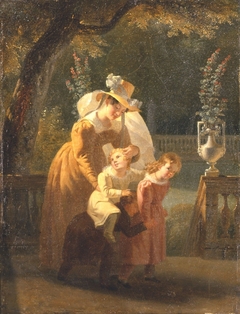 Femme et enfants jouant sur la terrasse d'un parc
