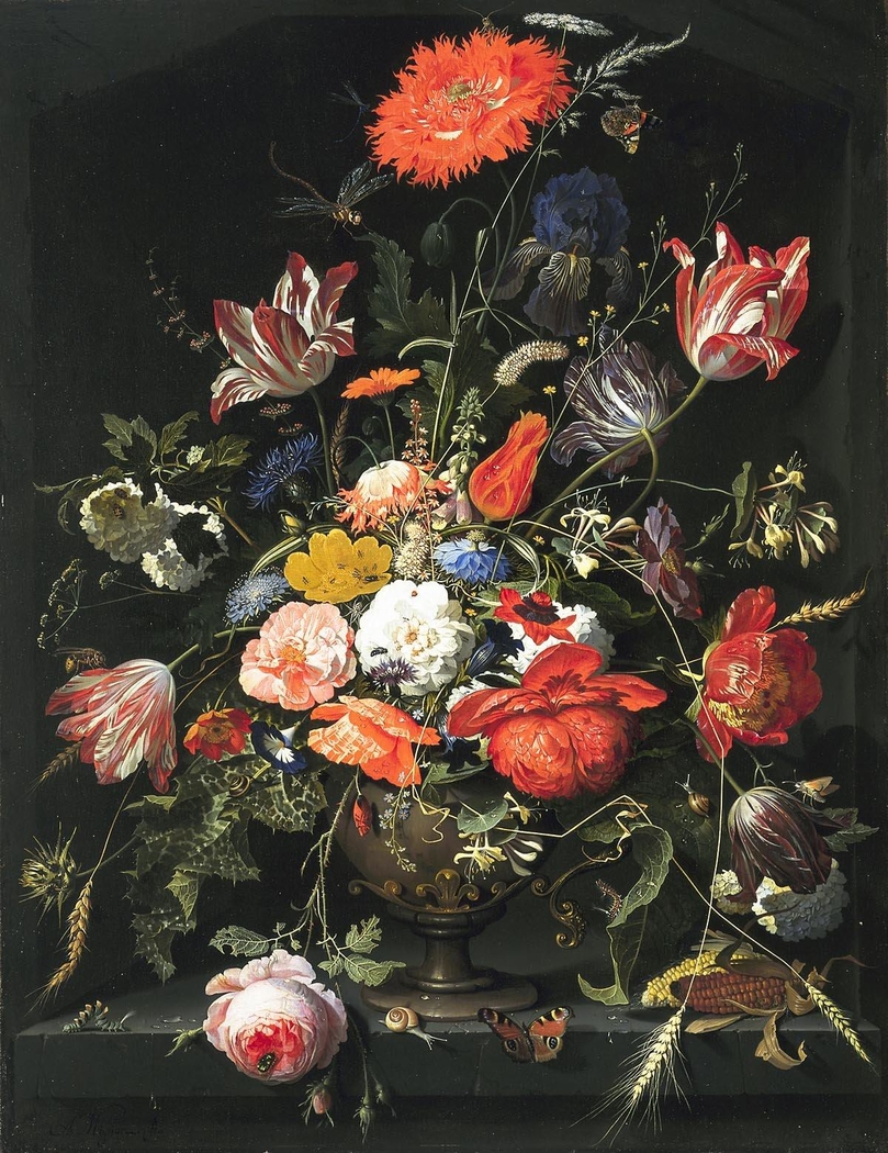 Flowers in a metal vase in a niche