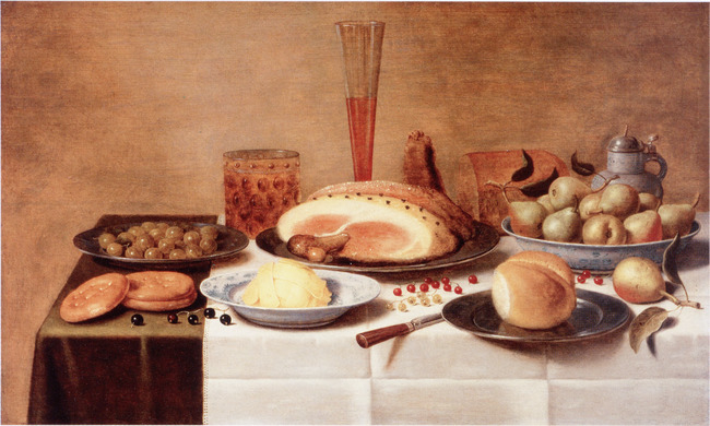 Still life with a ham on a laid table