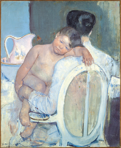 Woman Sitting with a Child in Her Arms